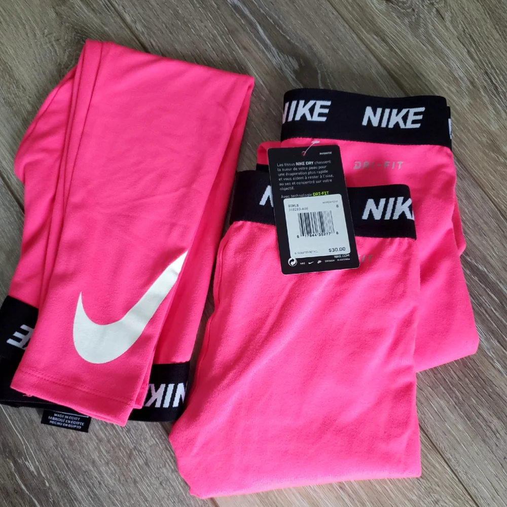Girl's Nike Hot Pink athletic Leggings, White Swoosh Black Waistband Size 5 Or 6